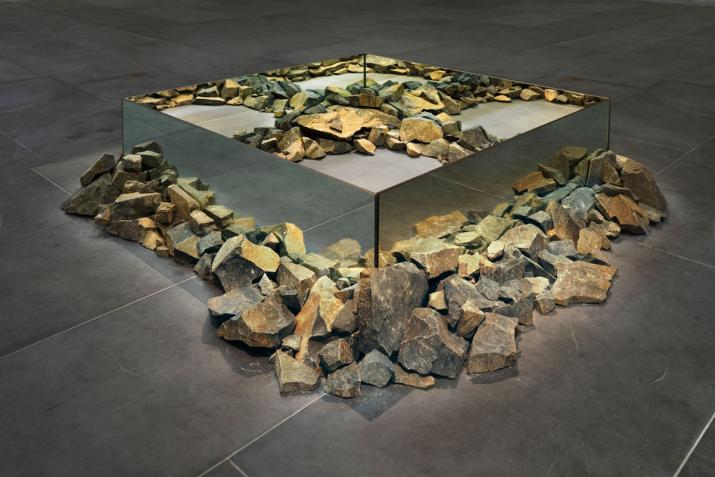 sculpture made using rocks and mirrors in a square shape
