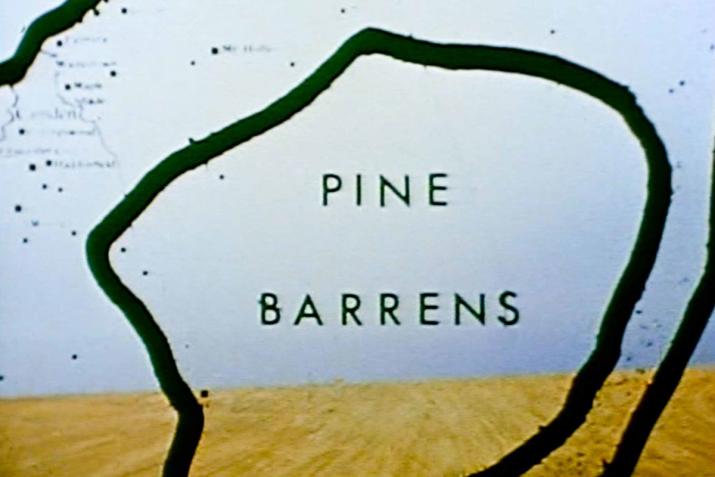 graphic overlay that says "pine barrens" over a desert and overcast sky