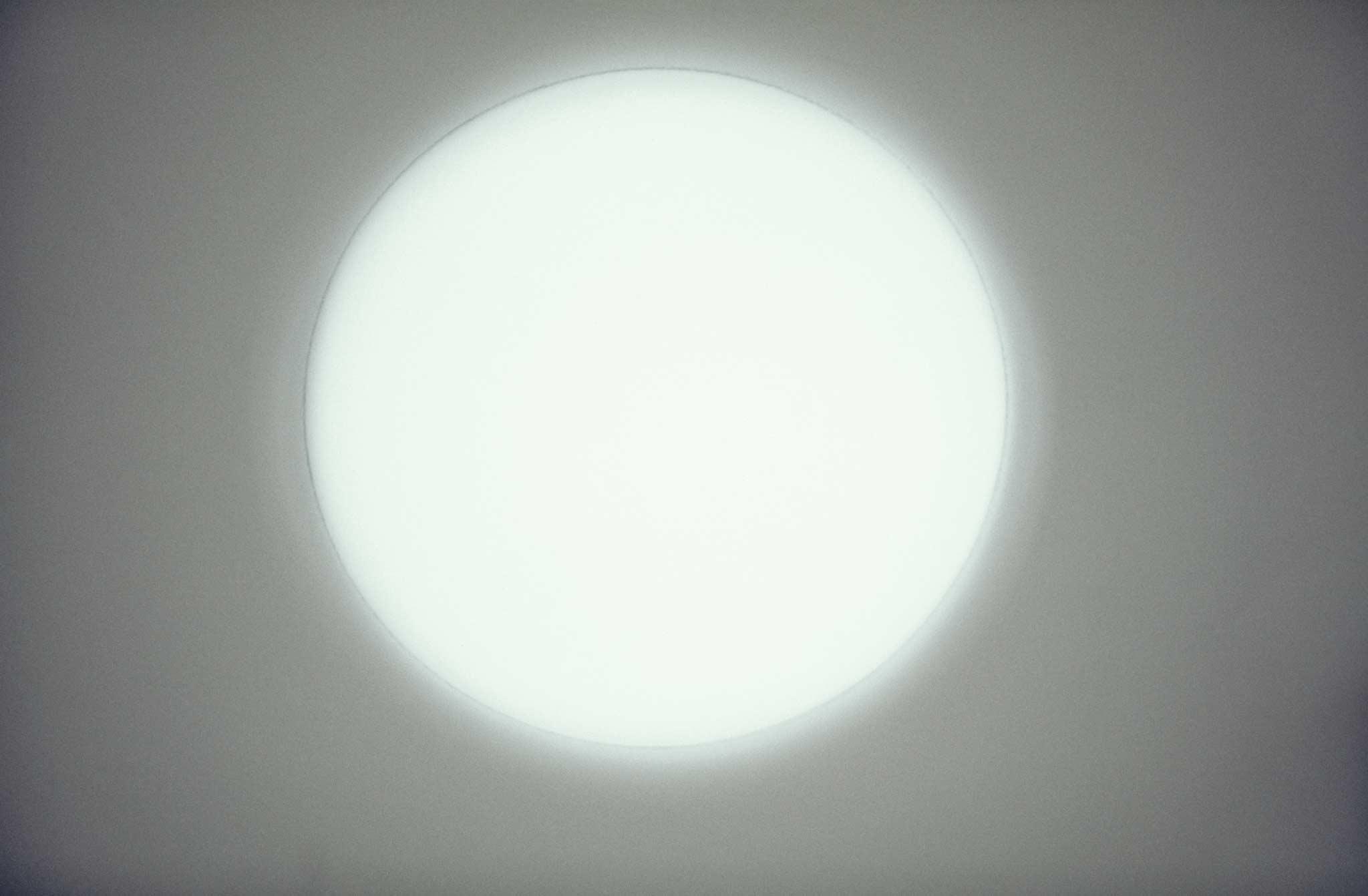 Circle of light on a white wall