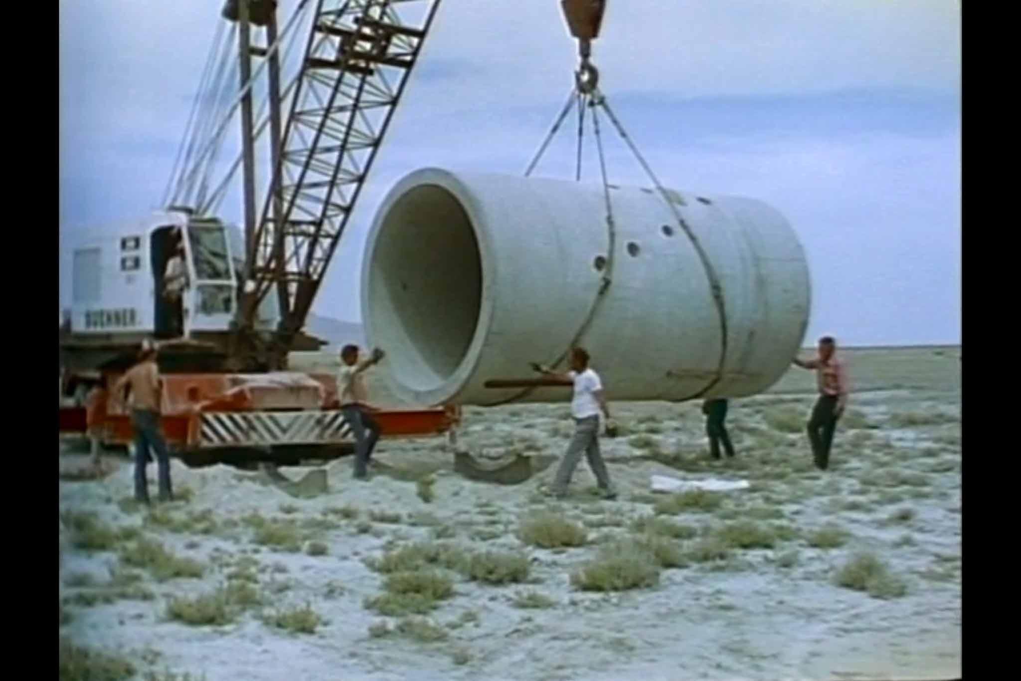 A film still from the construction of Holt's Sun Tunnels from the film, Sun Tunnels.