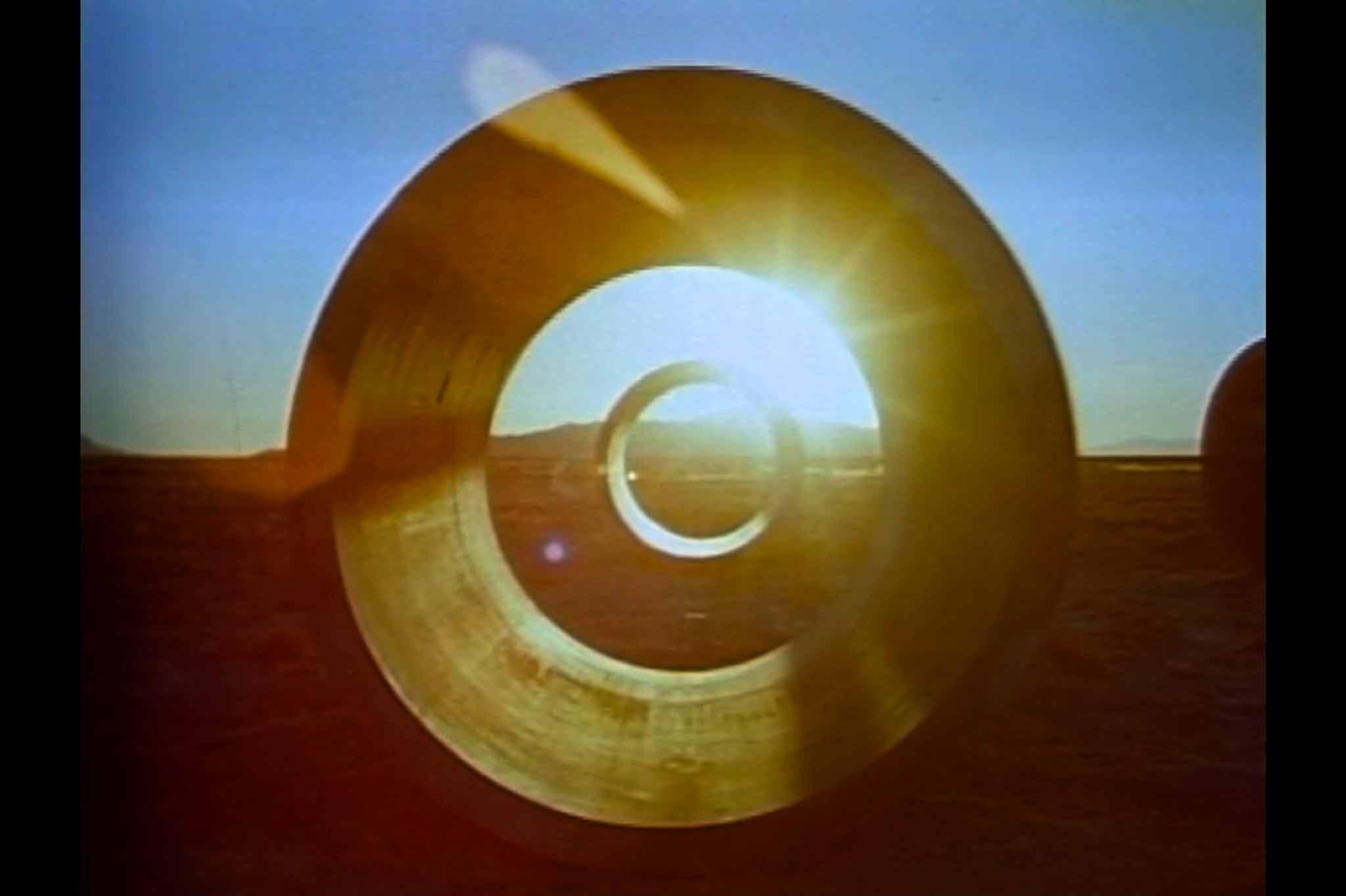 A still from the Sun Tunnels film showing sunset through one of the tunnels.
