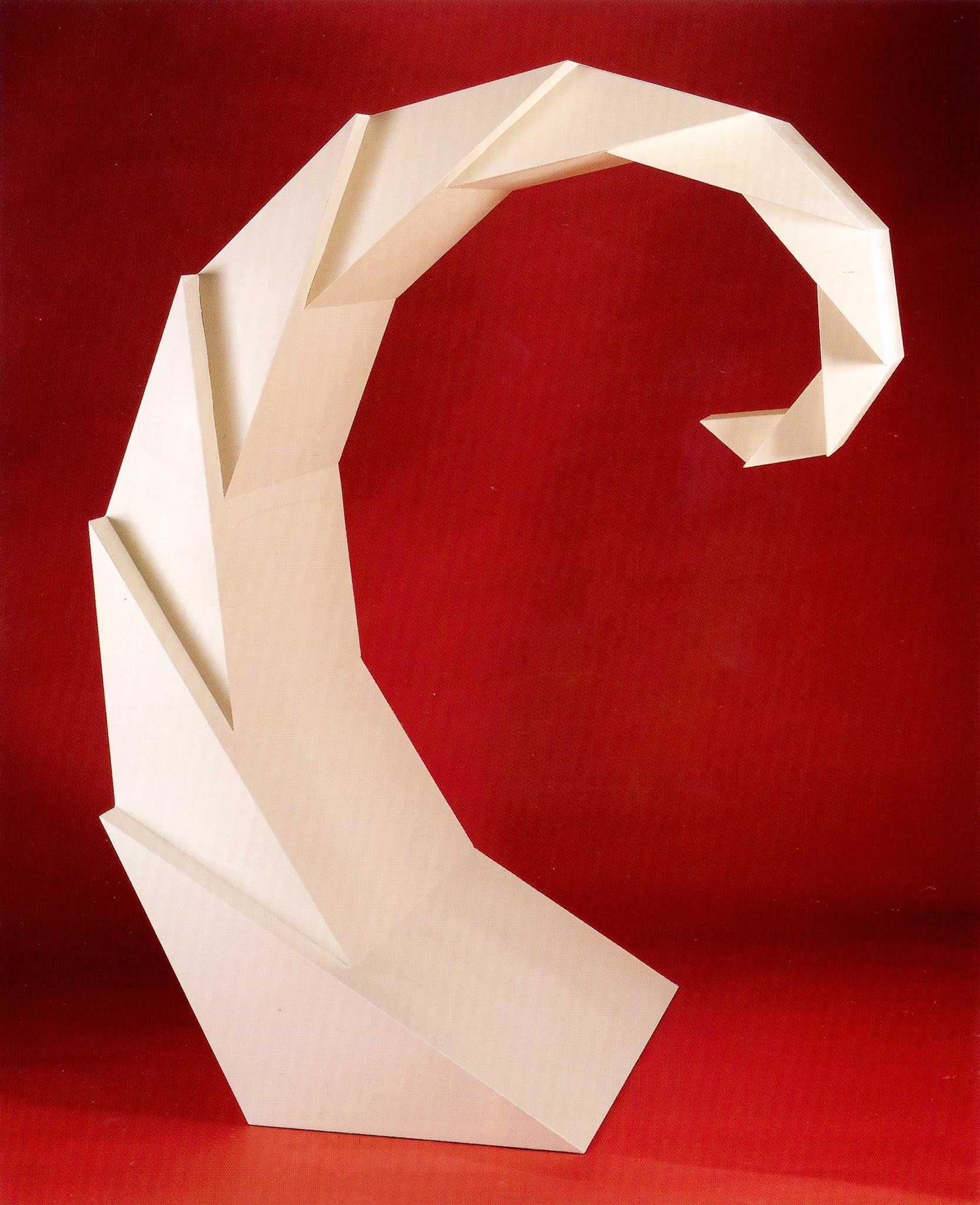 white geometric, faceted spiraling sculpture with a red background