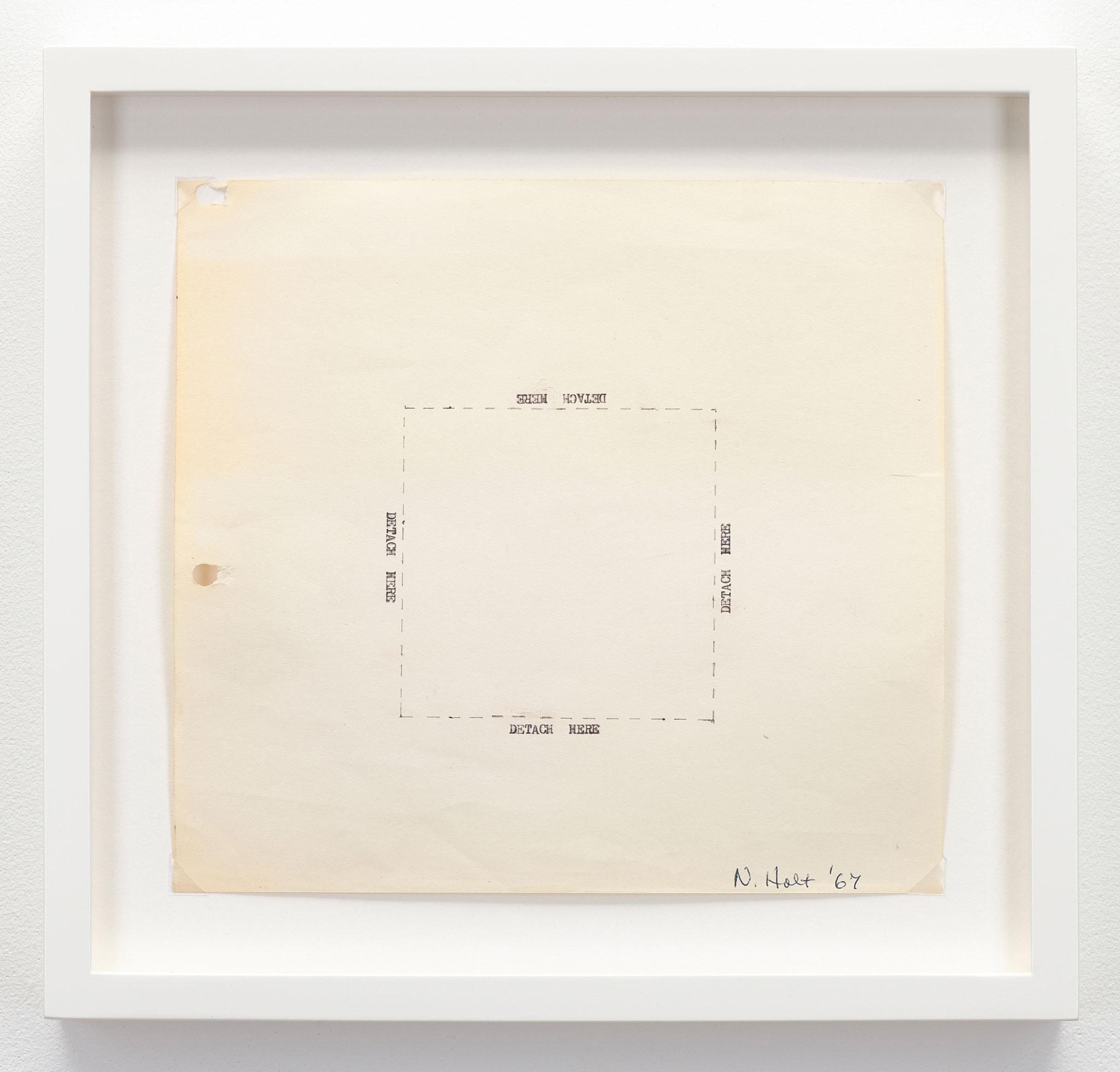 framed square piece of paper with the words "detach here" typewritten on each side of a box drawn with dashed lines