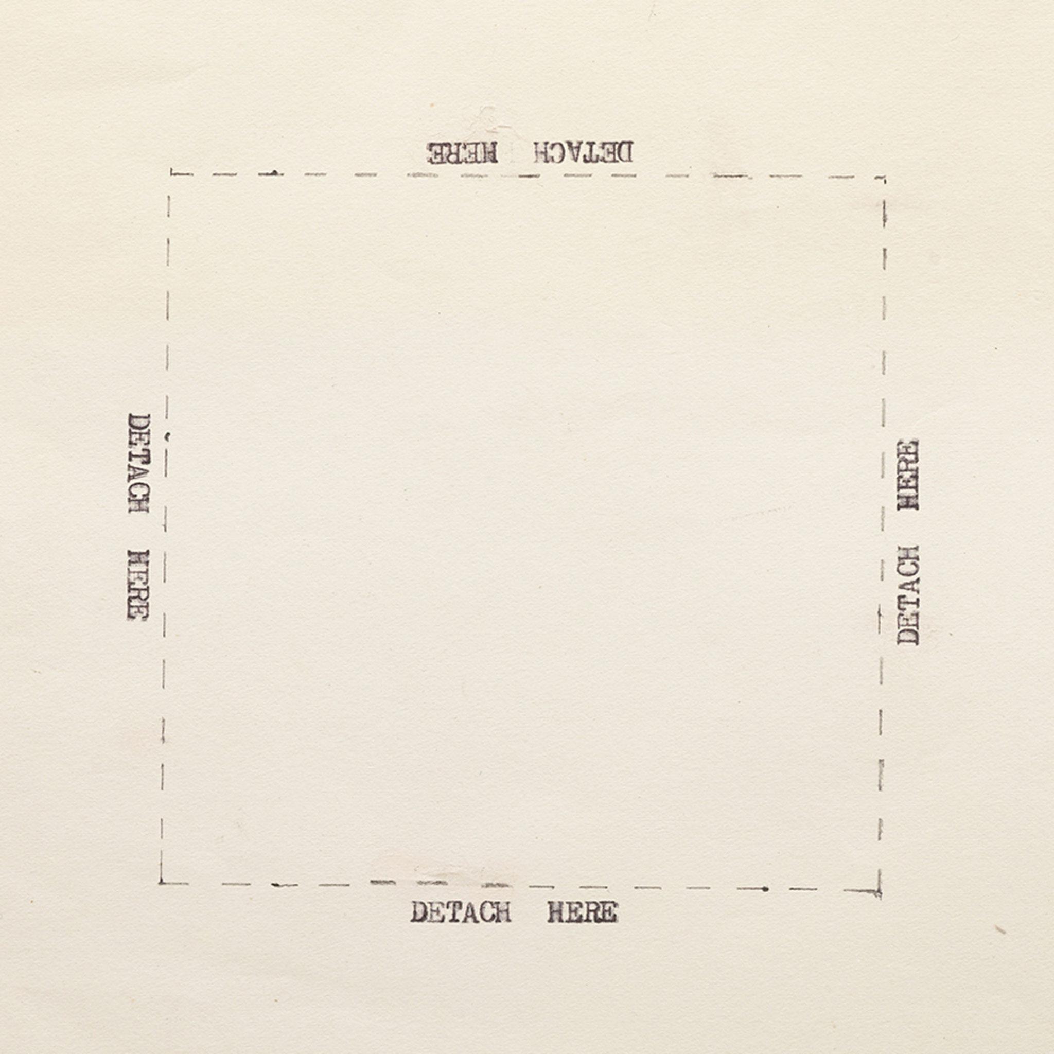 square piece of paper with the words "detach here" typewritten on each side of a box drawn with dashed lines