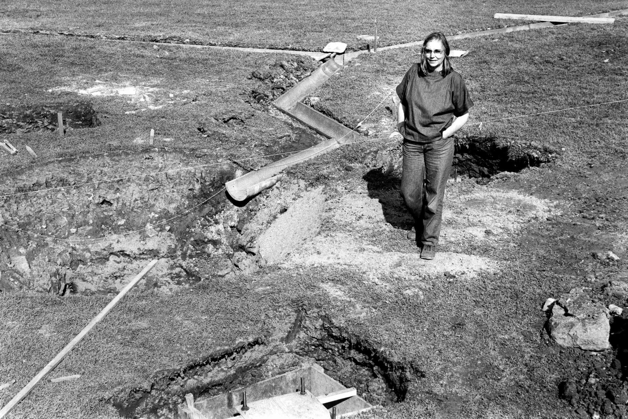 Nancy Holt walking through the site of her land drainage sculpture 