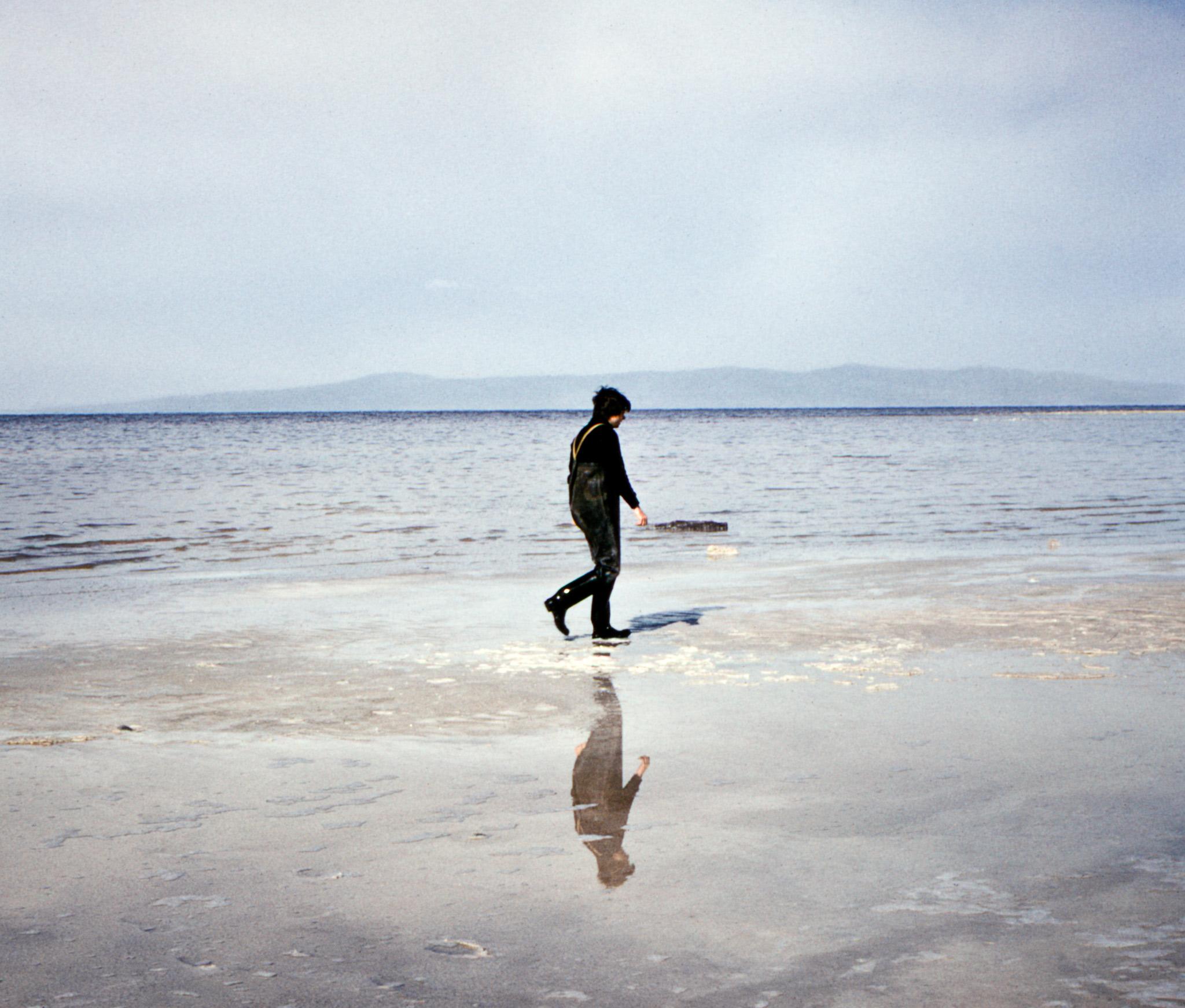 Robert Smithson walking the shore at Spiral Jetty