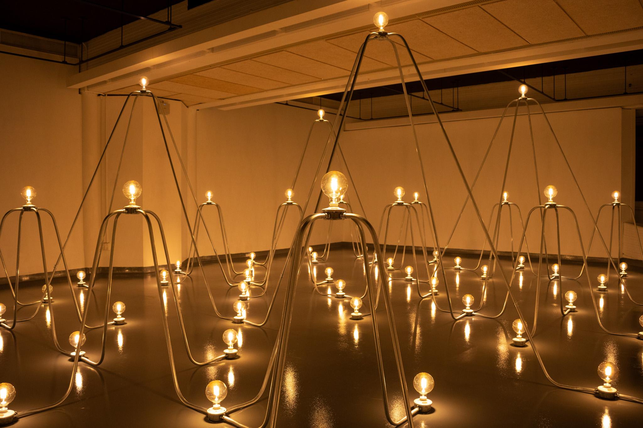 Nancy Holt's Electrical system is a network of arching conduit and lightbulbs